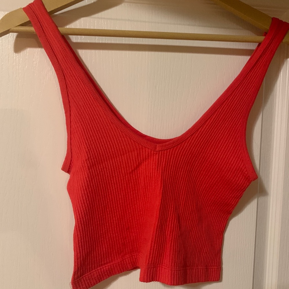 Urban Outfitters out from under red crop top